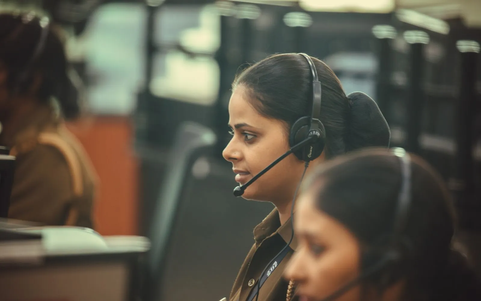 Lead generation team following up new enquiries on a headset