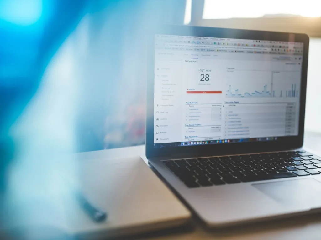 Laptop showing website traffic and analytics reports