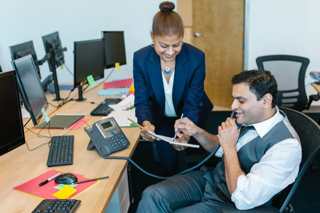 Business professionals reviewing documents at a desk