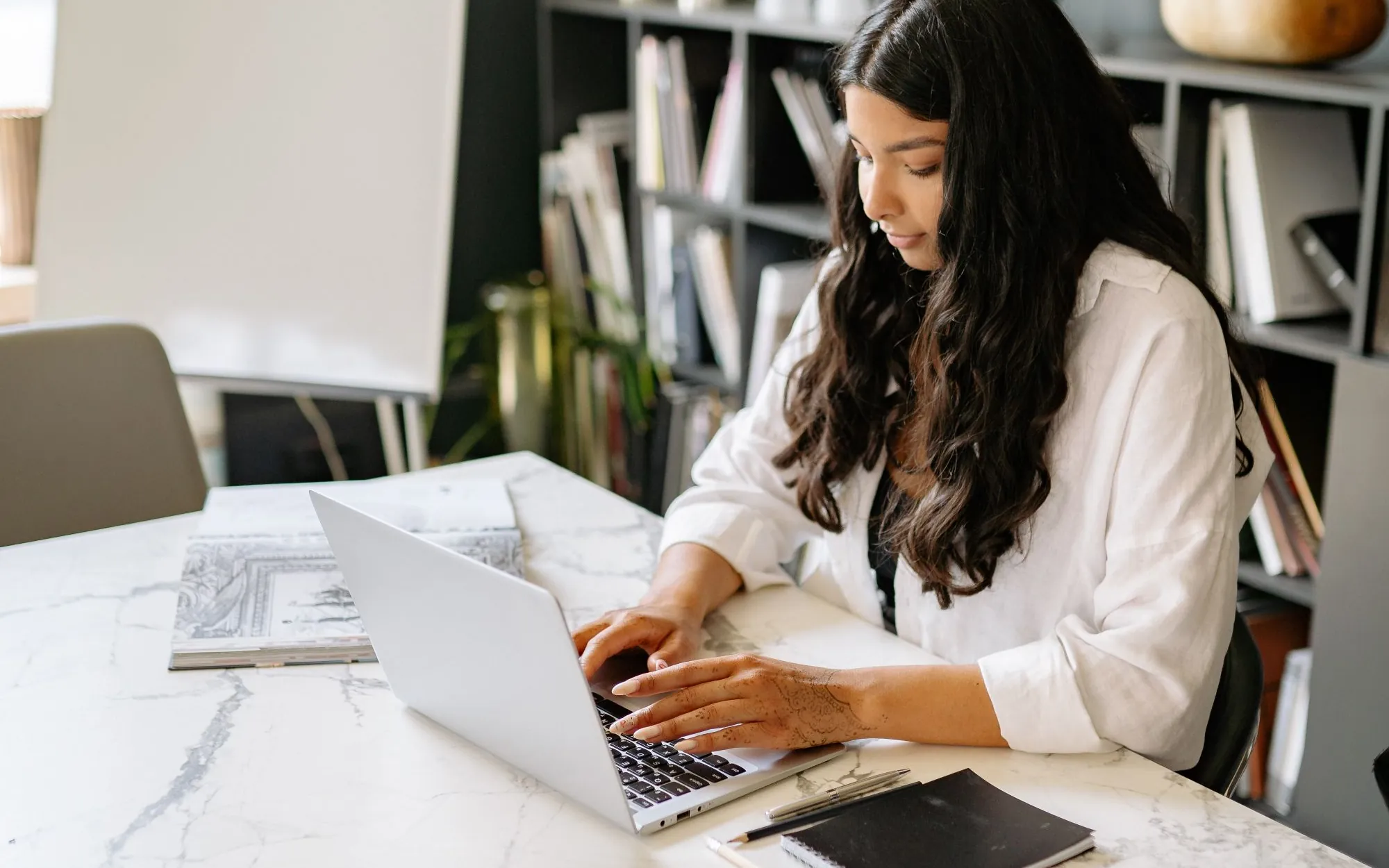 LinkedIn profile writing – writer drafting a headline and About section on a laptop