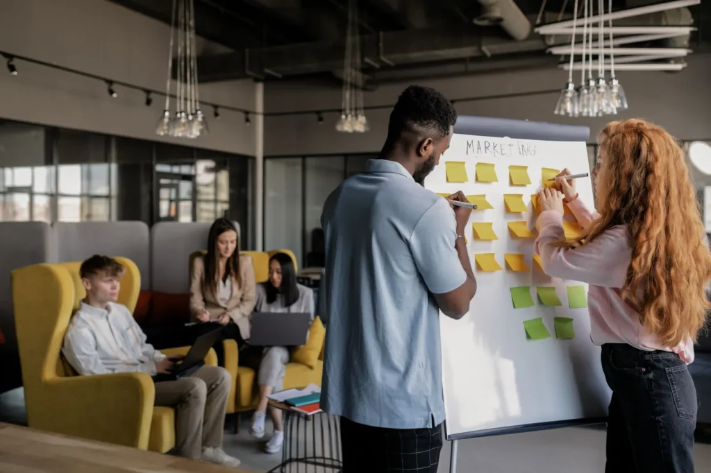 Team planning a marketing calendar with sticky notes